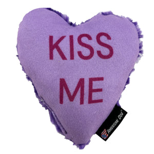 Purple heart shaped dog toy with 'Kiss Me' on it