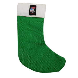Green stocking shaped dog toy with white at the top