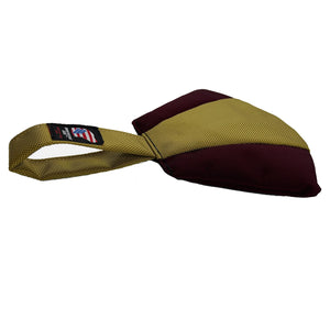 Side view of a fan shaped dog toy with handle. Maroon and gold colors