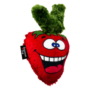 Plush dog toy shaped like a strawberry with a smiling cartoon face and an American Dog label