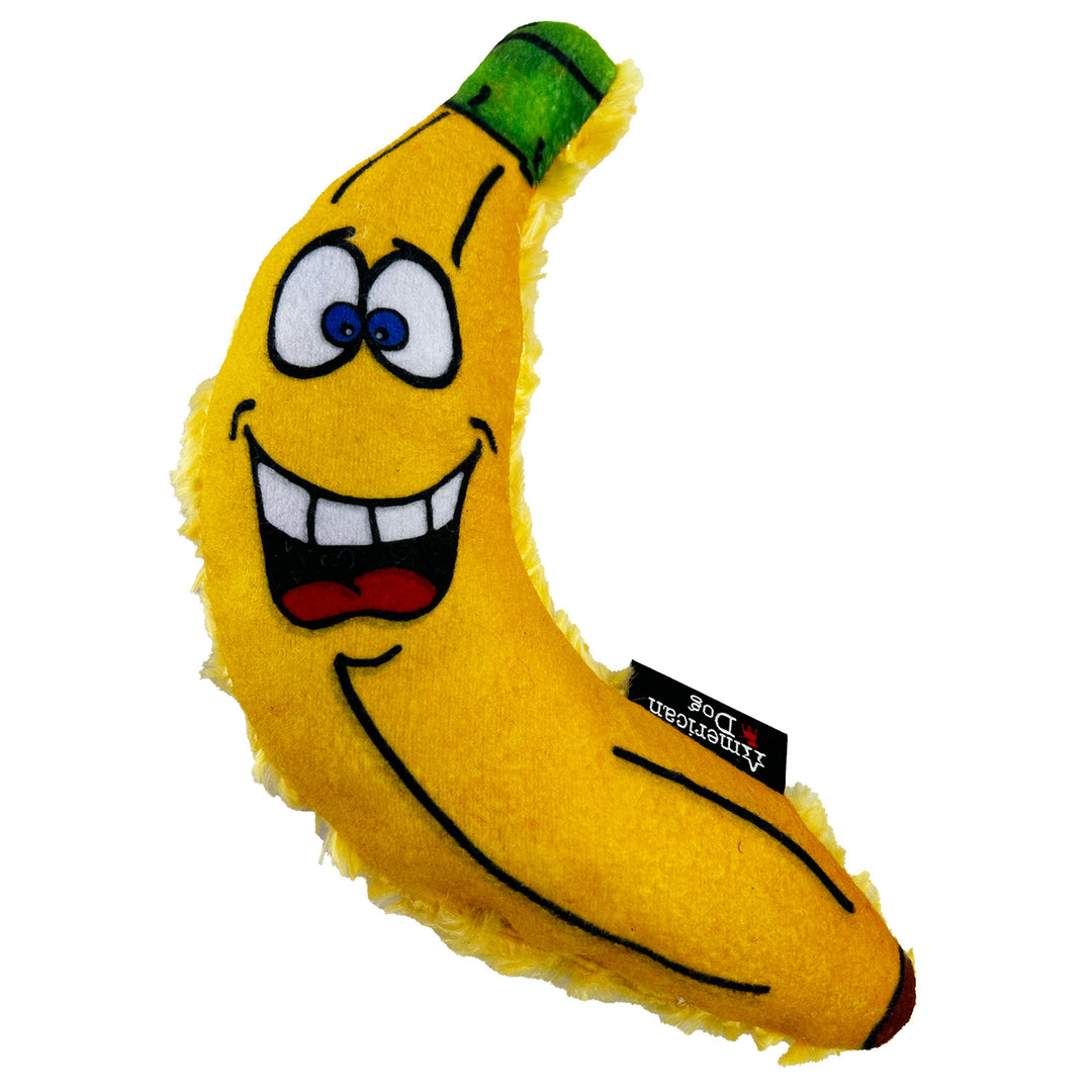 Plush banana dog toy with a face on a white background