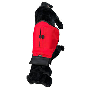 Black dog wearing a red training vest  