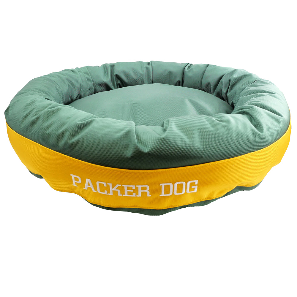 green and gold round bolster bed wth embroidered 'packer dog' 