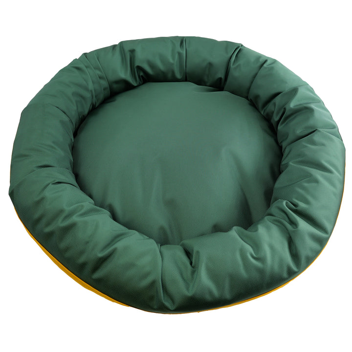 top view of round bolster dog bed that is green