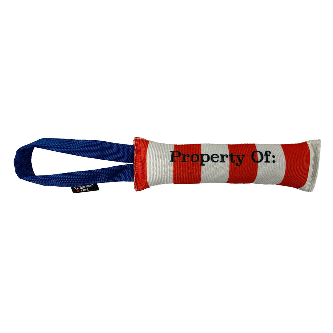 Red & white striped fire hose dog toy with text 'property of' and blue handle