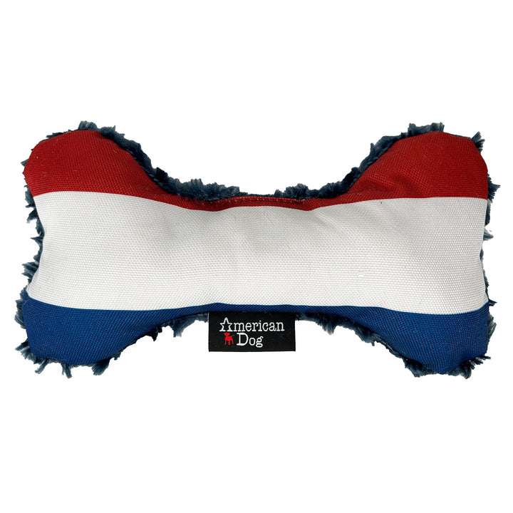 Red, white, and Blue  nylon & fleece bone-shaped toy with an American Dog brand logo.