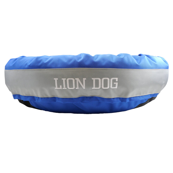 Blue and silver dog bed with 'Lion Dog' embroidered