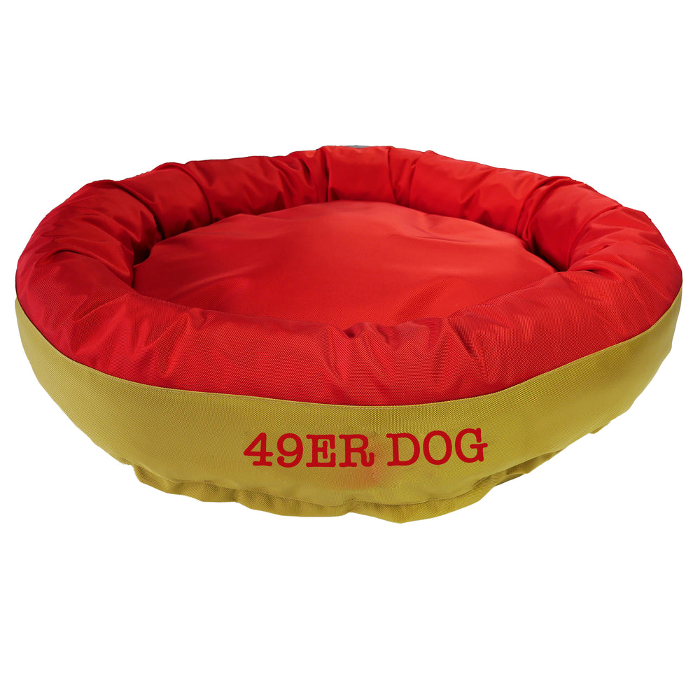 Red & gold round bolstered dog bed with red embroidered '49er dog'.