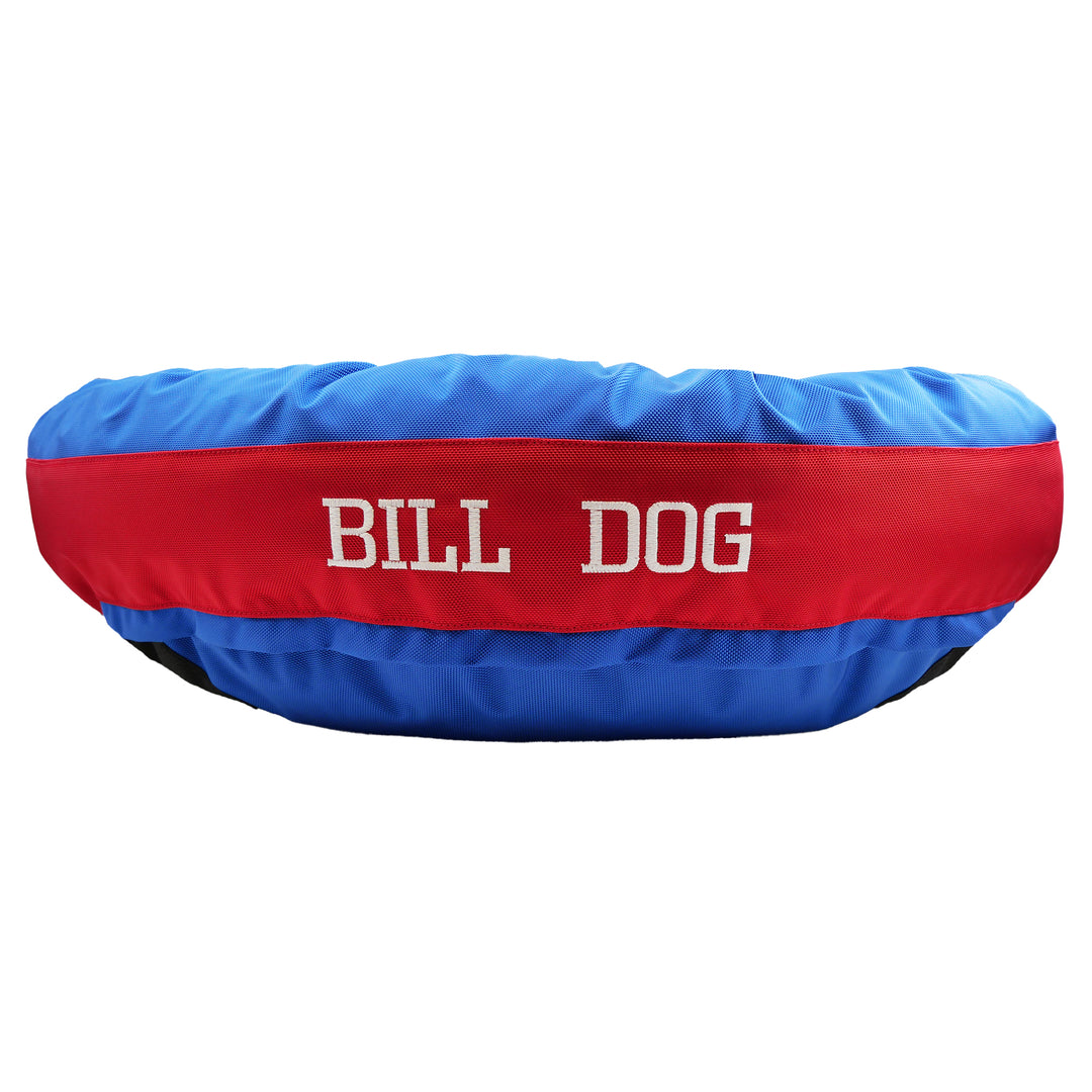 Blue and red dog bed with Bill Dog embroidered in white
