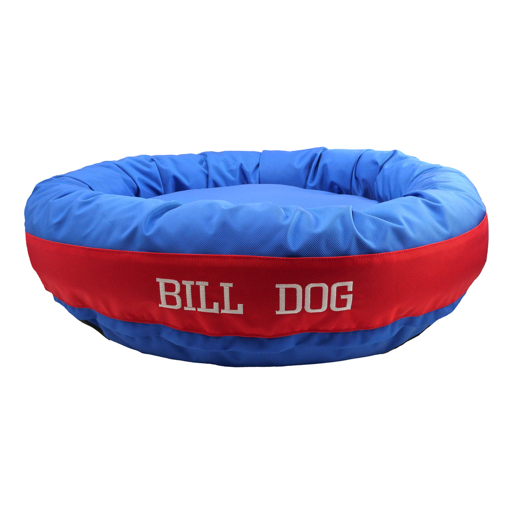 Round bolstered Blue and red dog bed with Bill Dog embroidered in white