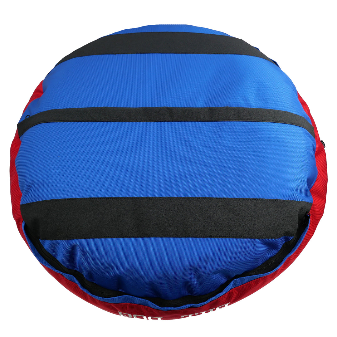 Bottom view of Blue and red dog bed with black strips 