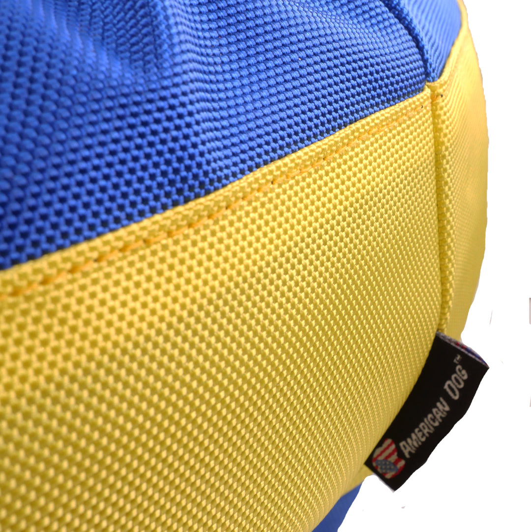 close up view of dog bed yellow and blue fabric
