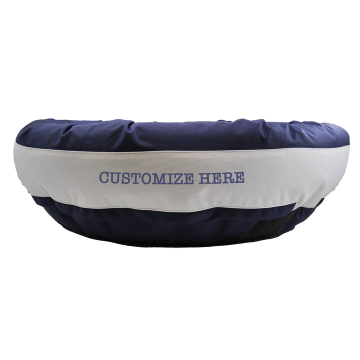 Dark blue and white dog bed with Customize Here embroidered in dark blue