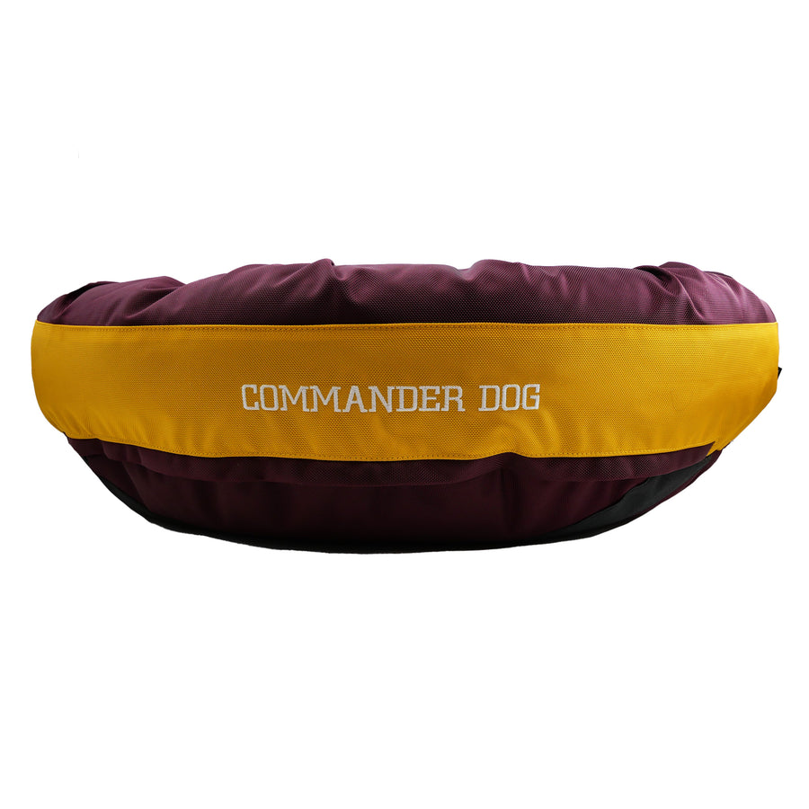 Maroon and gold dog bed with Commander Dog embroidered in white
