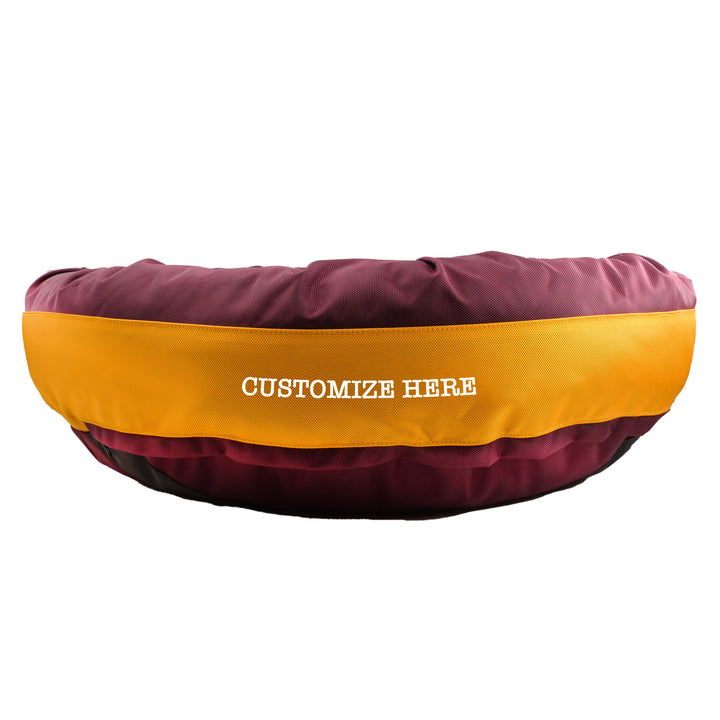 Round Bolster Maroon and gold dog bed with Customize Here embroidered in white