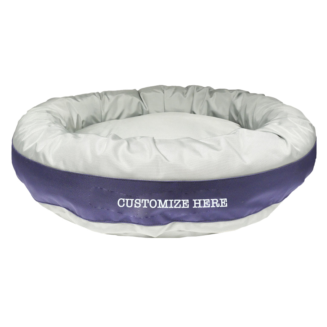 Silver round bolstered dog bed with navy band with white embroidered 'Cowboy Dog.