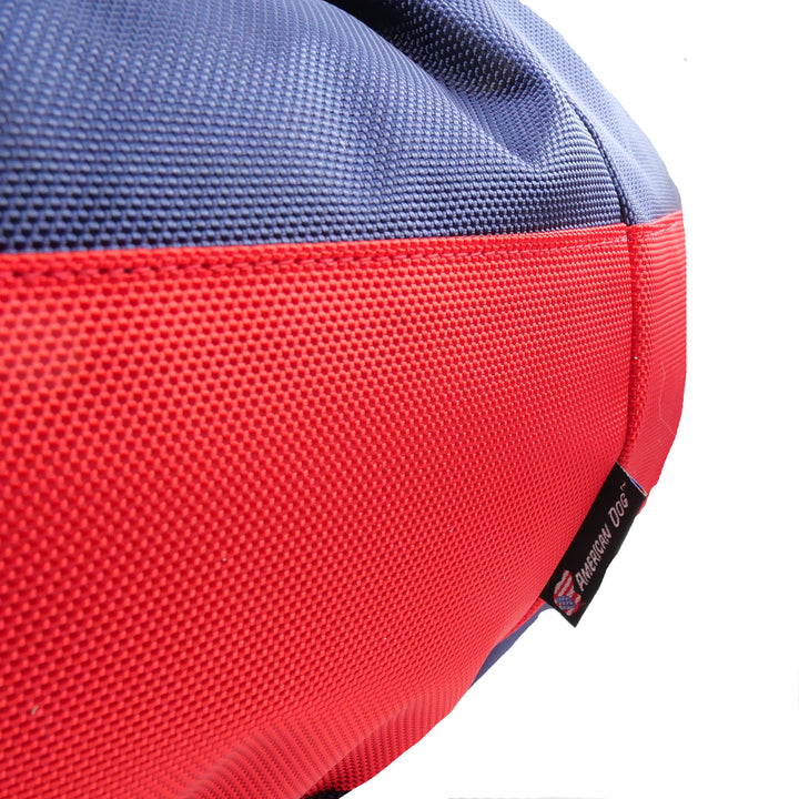 close up view of blue and red dog bed