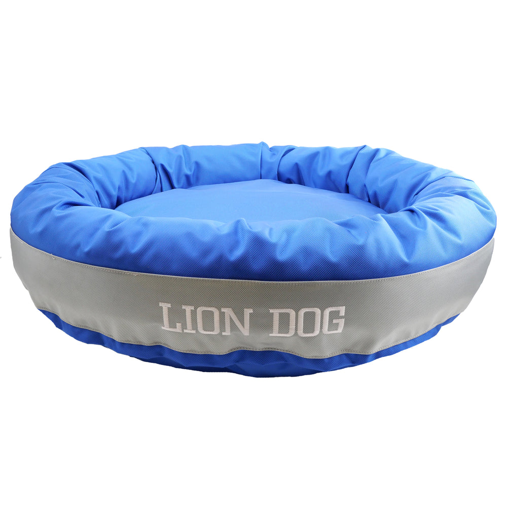 blue and silver round bolster dog bed with embroidered 'Lion Dog'