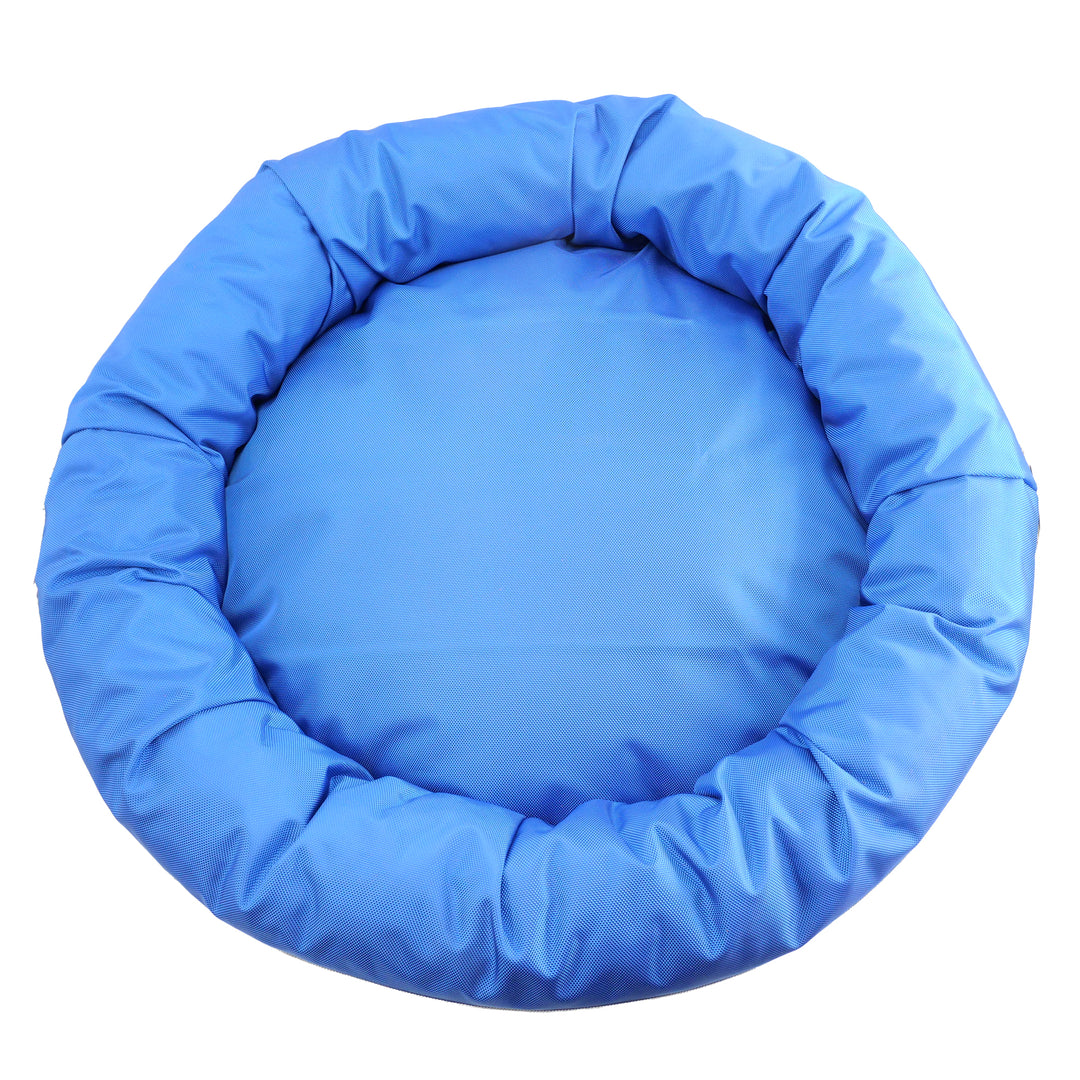 Top view of round bolster dog bed.  Solid blue
