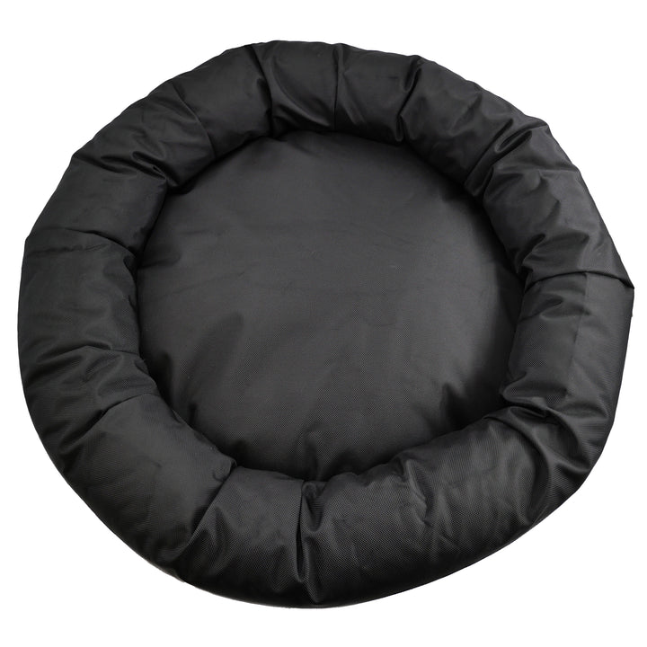 Top view of black round bolstered dog bed.