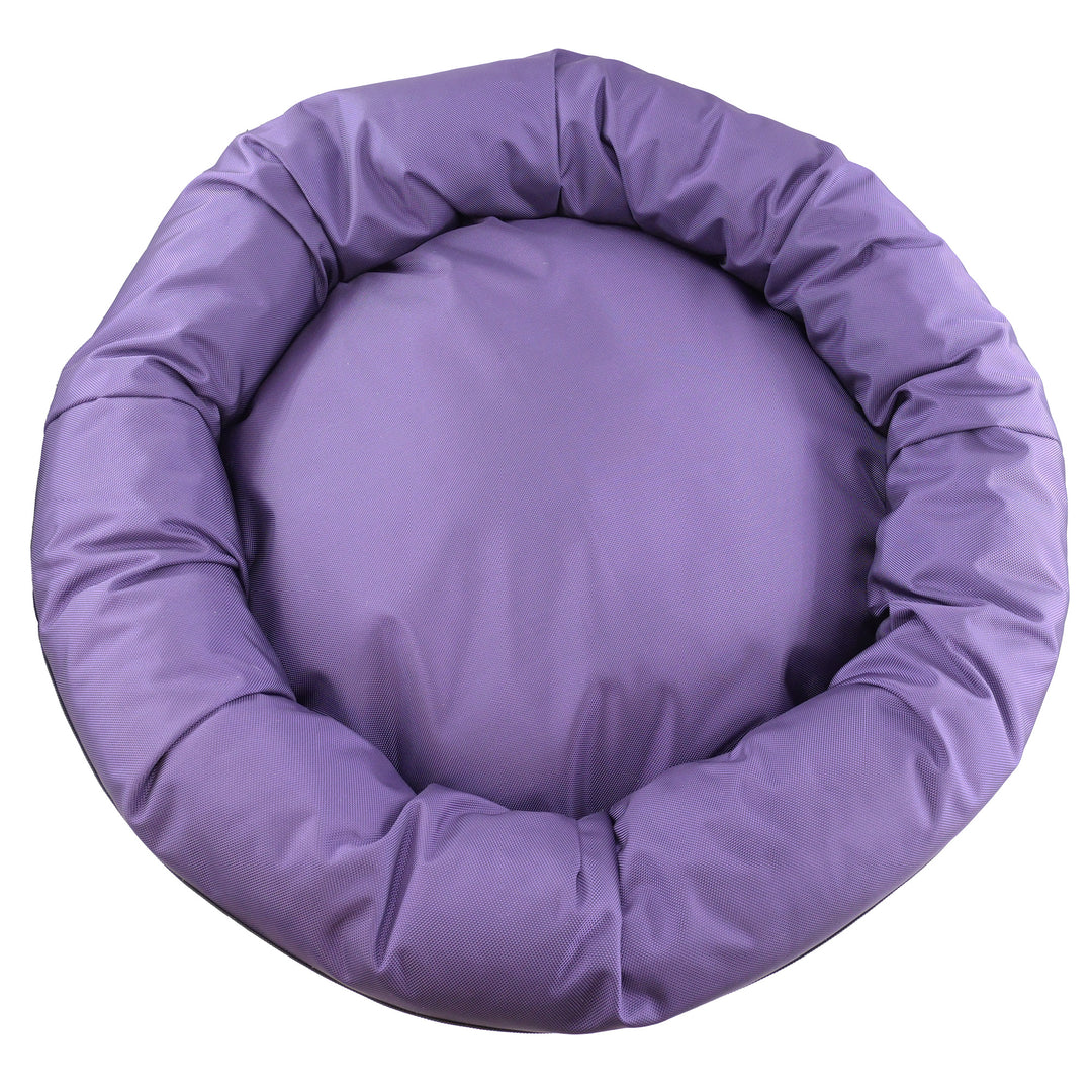 Top view of round bolster dog bed that is purple