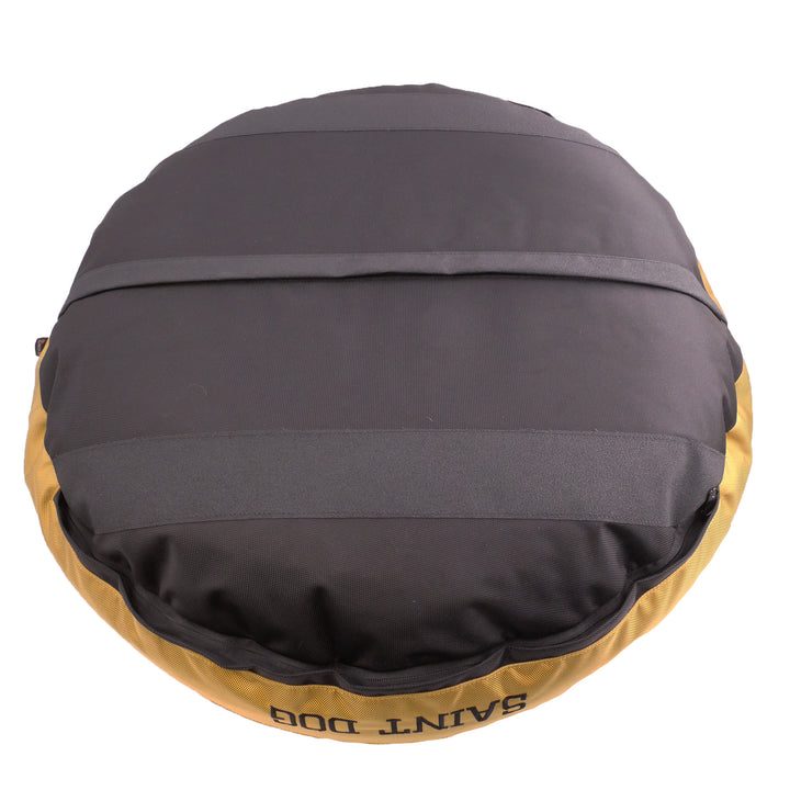 Black bottom of round dog bed with black stripes