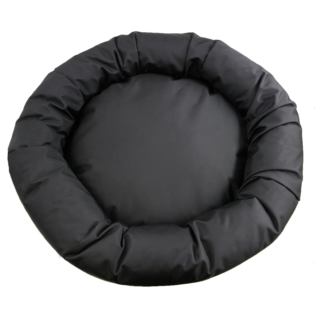 Top view of black round bolstered dog bed.
