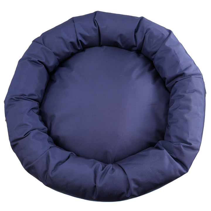 Top view of blue round bolstered dog bed