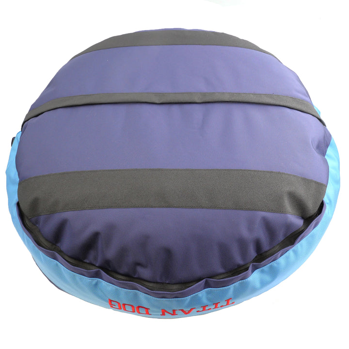 Bottom view of blue and light blue dog bed with black strips