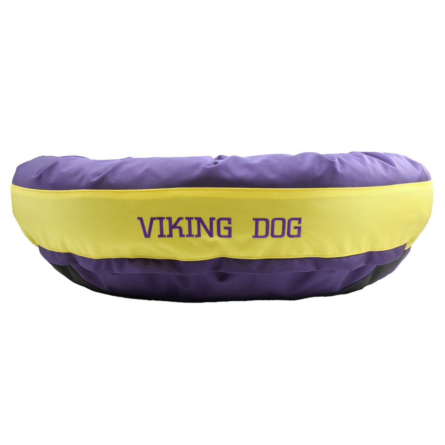 Purple round bolstered dog bed with yellow band and purple embroidered 'Viking Dog'.