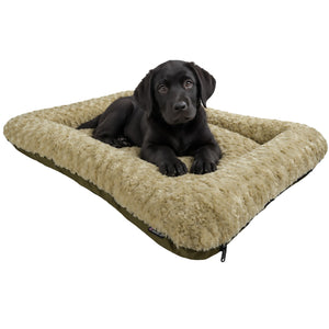 black lab puppy on a tan colored fluffy dog bed