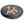 Beagle dog laying on a round gray dog bed 