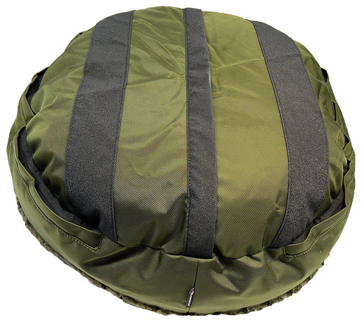 Round fuzzy olive bolster bed back side showing grip strips