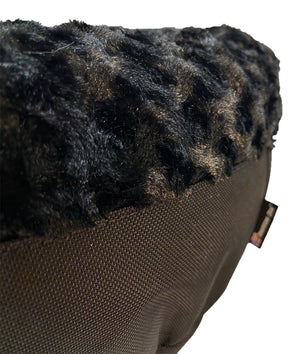 Round fuzzy black bolstered d bed close up showing textureg lower fabric
